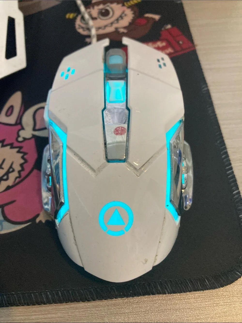 White Gaming Mouse with Cyan LED Accent